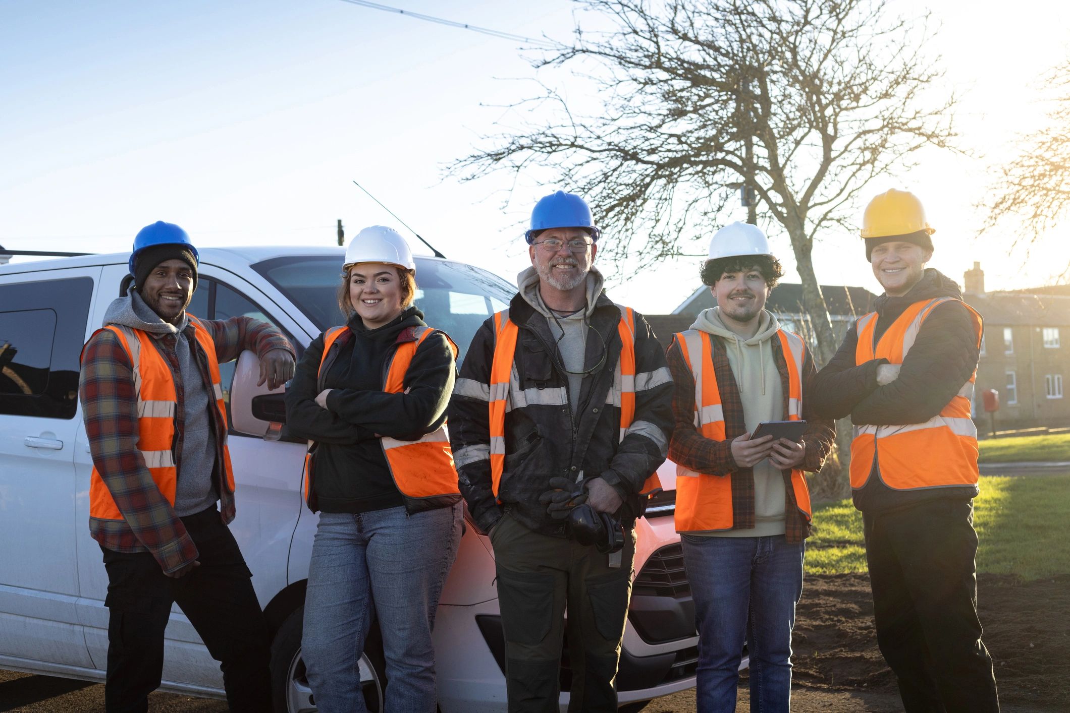 Electrical services team standing together at a worksite